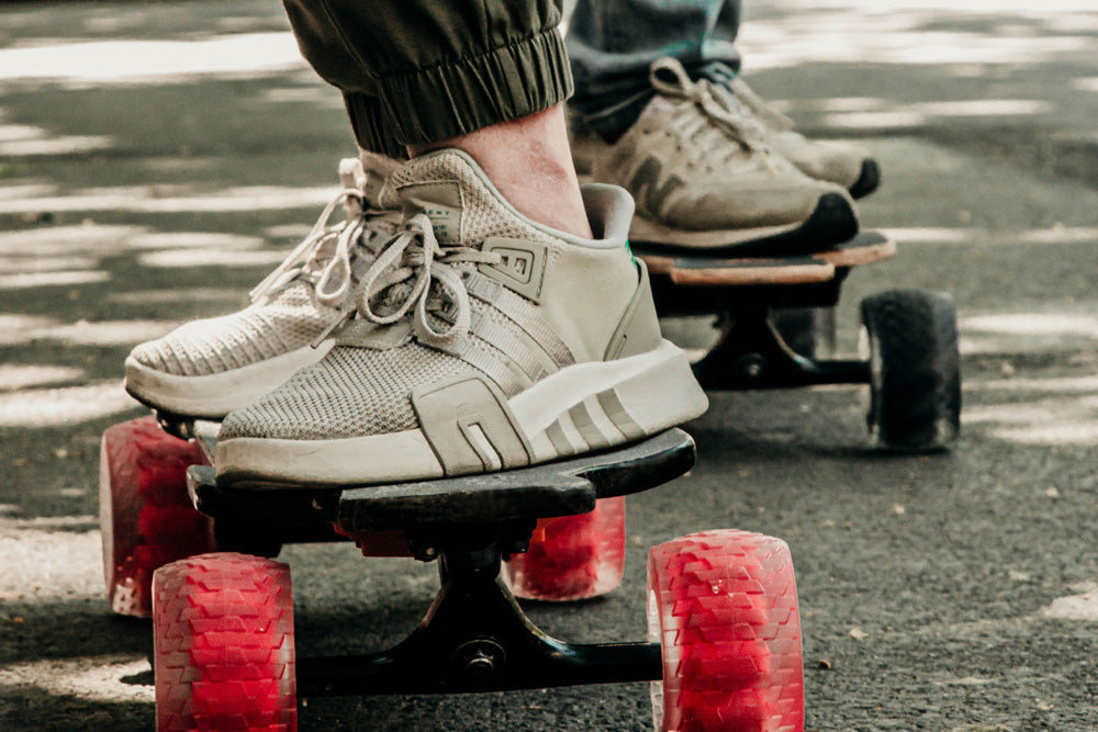 riding eskateboard red wheels